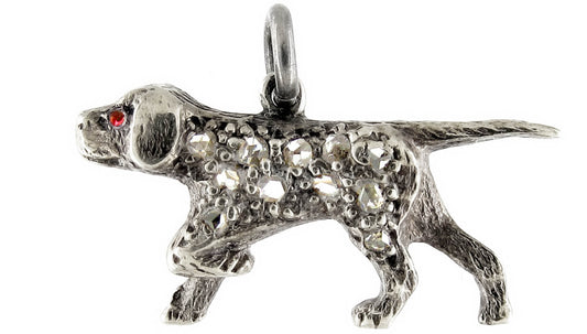 A sterling silver and diamond dog charm