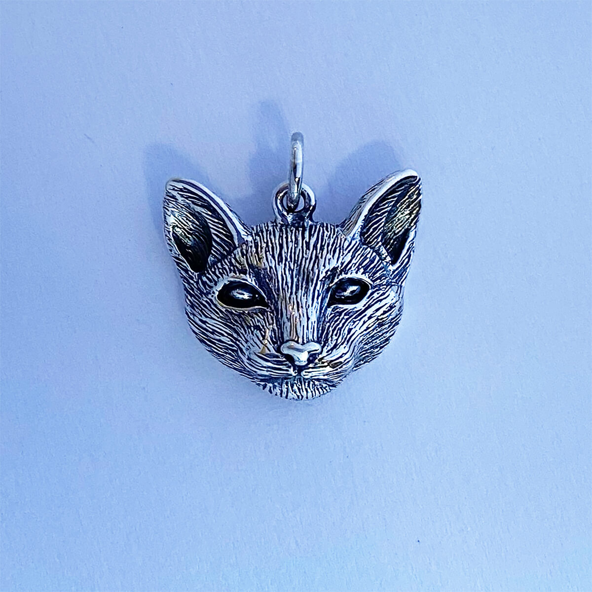 Realistic sterling silver cat's head pendant from Charmarama