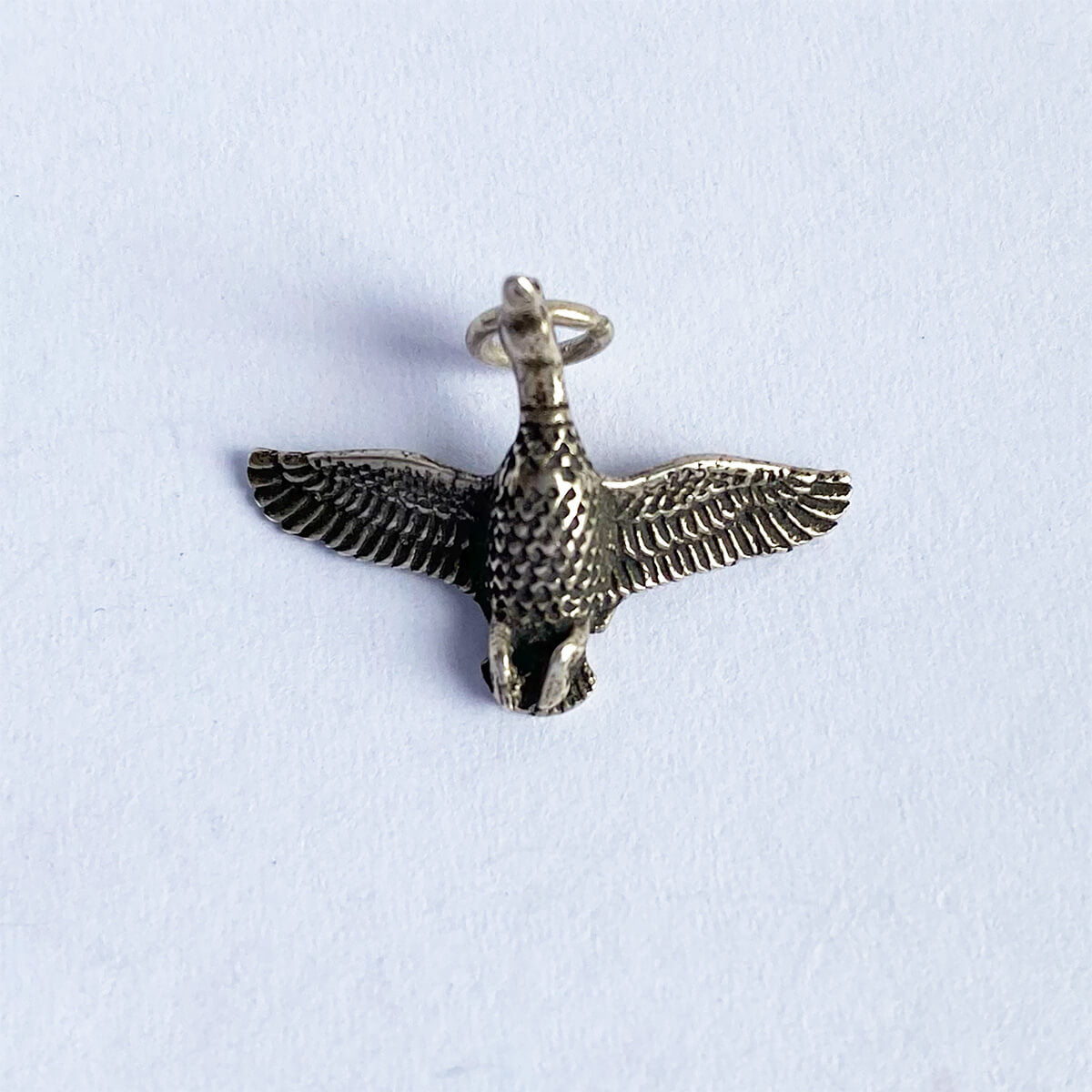 Vintage silver duck in flight charm