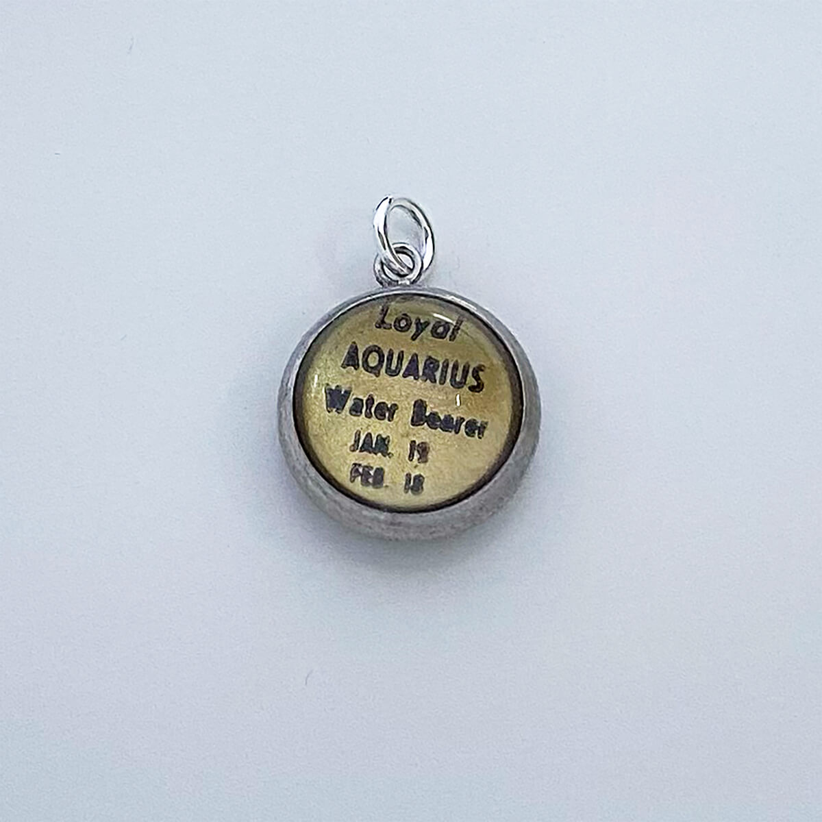 Vintage Essex Crystal Intaglio Charm Aquarius Zodiac Pendant from Charmarama Charms