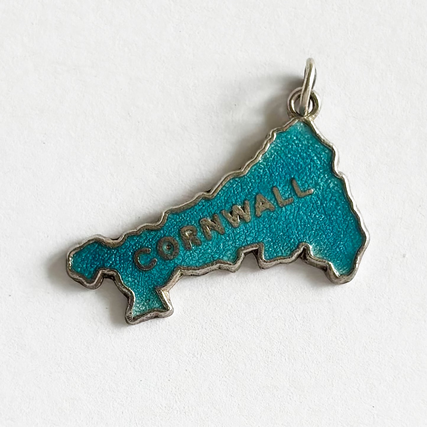 A vintage sterling silver and blue enamel Cornwall charm