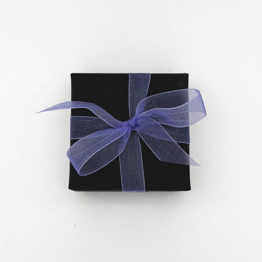 Black gift box with a purple ribbon on a white background