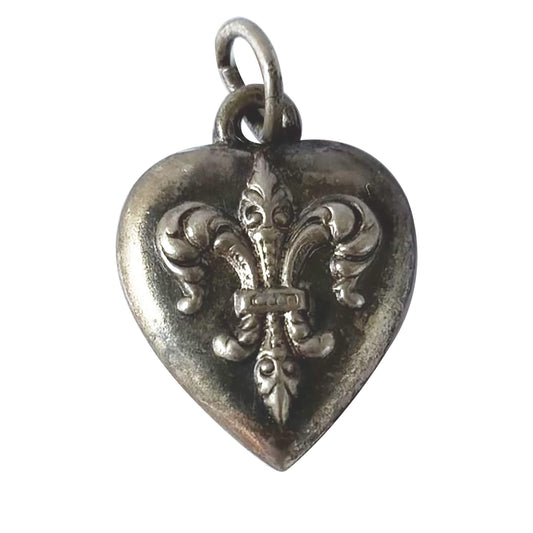 Sterling silver puffy heart charm with a fleur de lis symbol