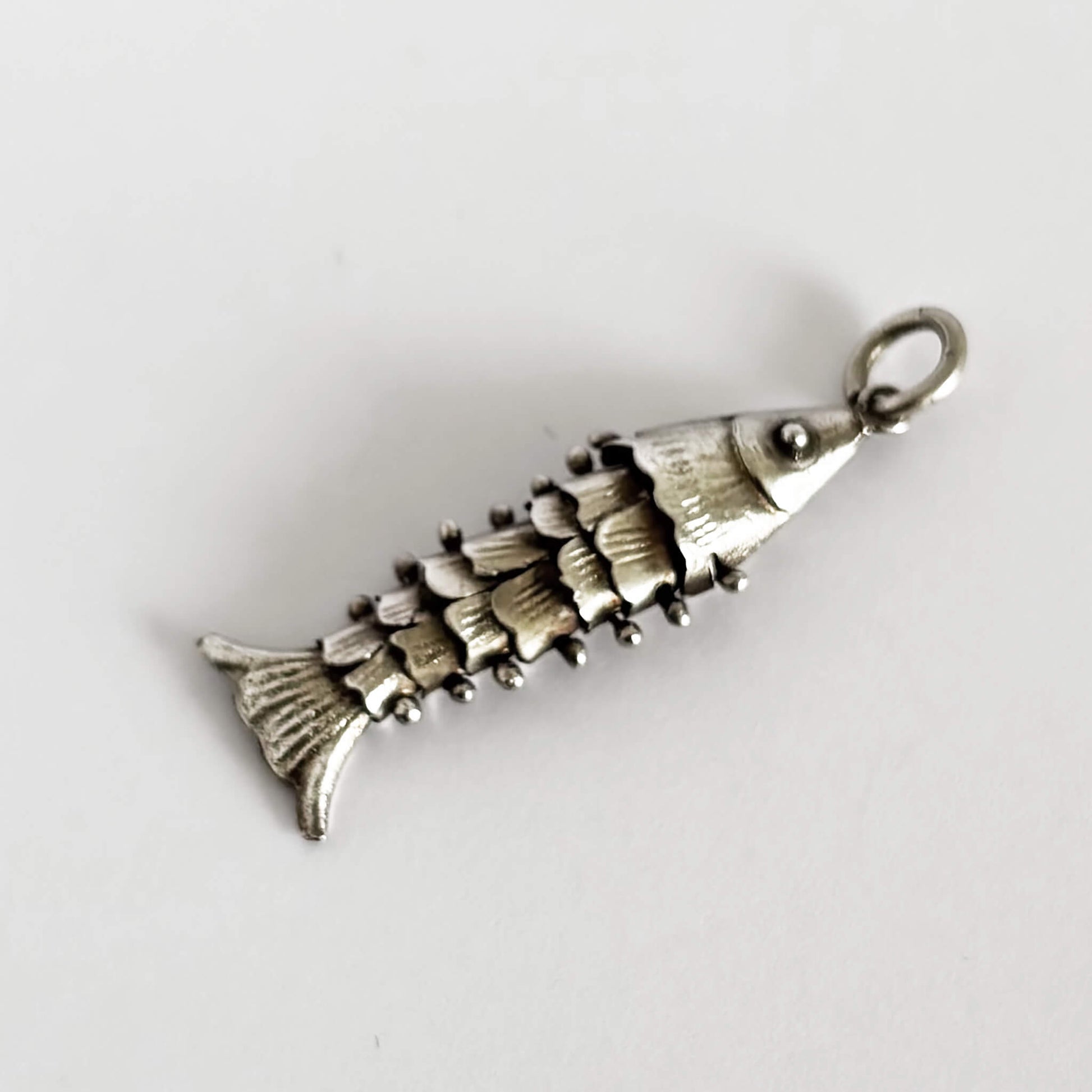 silver articulated fish pendant