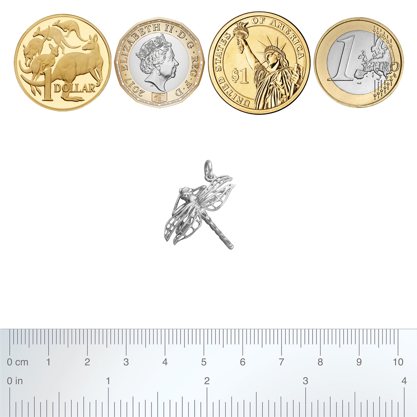 Sterling silver dragonfly charm with coins and ruler on a white background