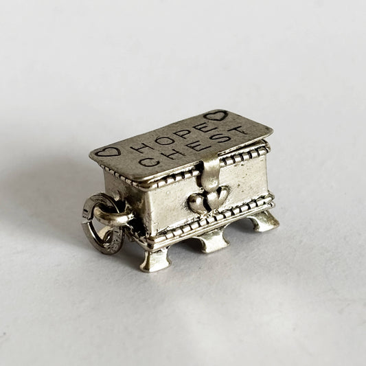 Sterling silver hope chest charm on a white background