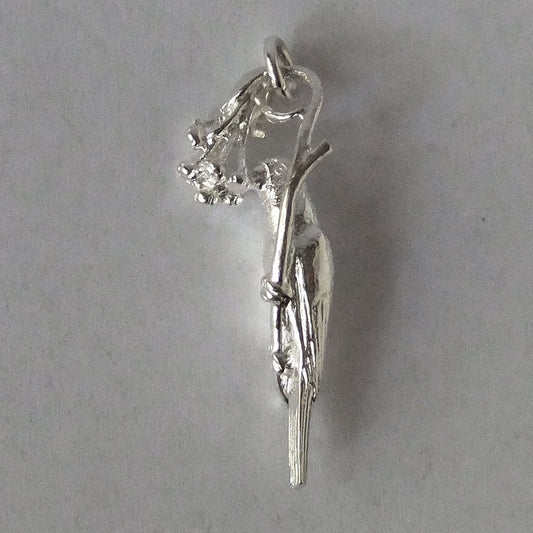 silver lorikeet bird charm on grey background