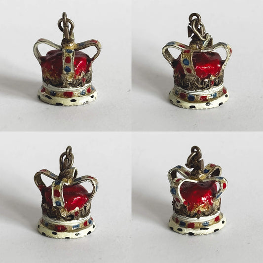 Four crown-shaped charms with red and multicoloured enamel on a white background