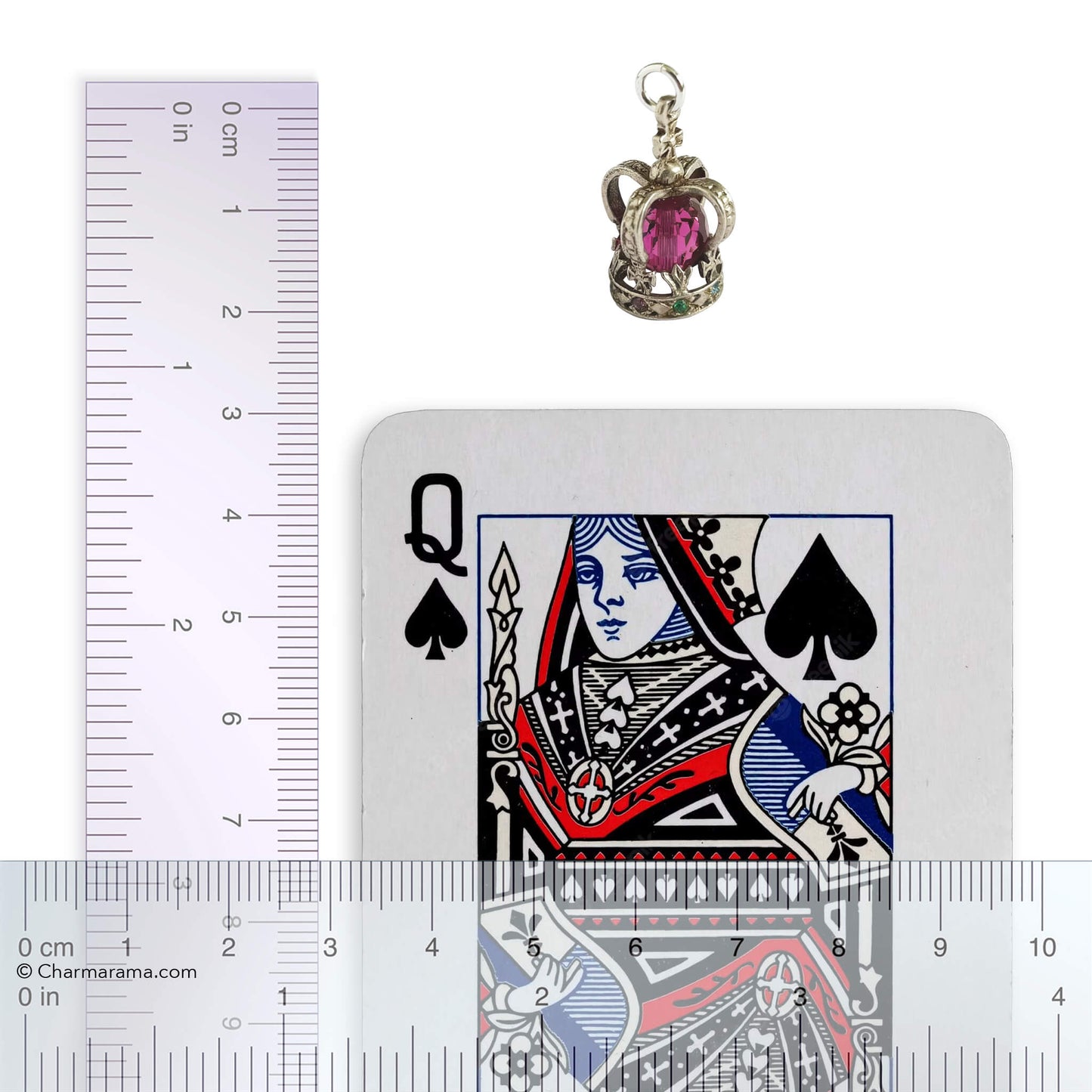 Crown pendant with a playing card and a ruler for scale