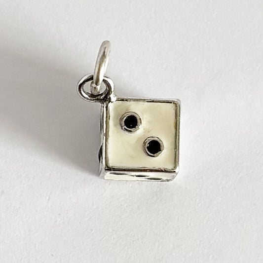 Vintage die charm in sterling silver white enamel with black dots