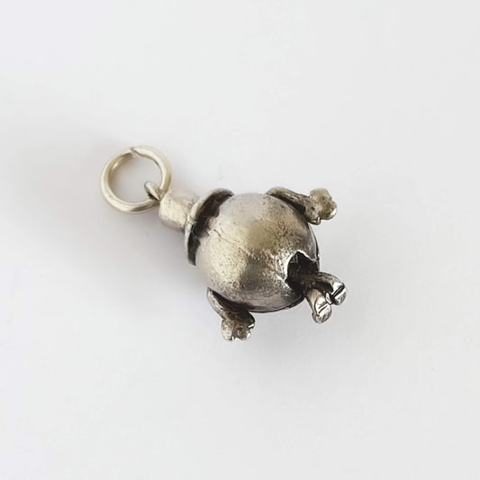 Silver Mr Happy pendant on a white background