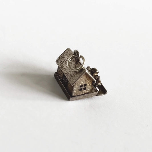 A vintage silver train in station charm on a white background