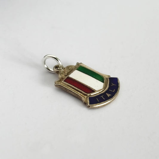 Sterling silver Italy flag travel shield charm on a white background