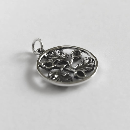 Sterling silver circle of three acorns and leaves charm