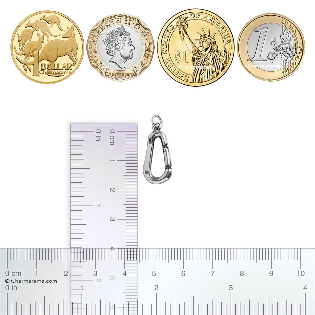 Silver carabiner charm next to a ruler and four coins on a white background