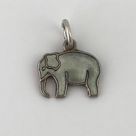 Silver elephant pendant on a white background