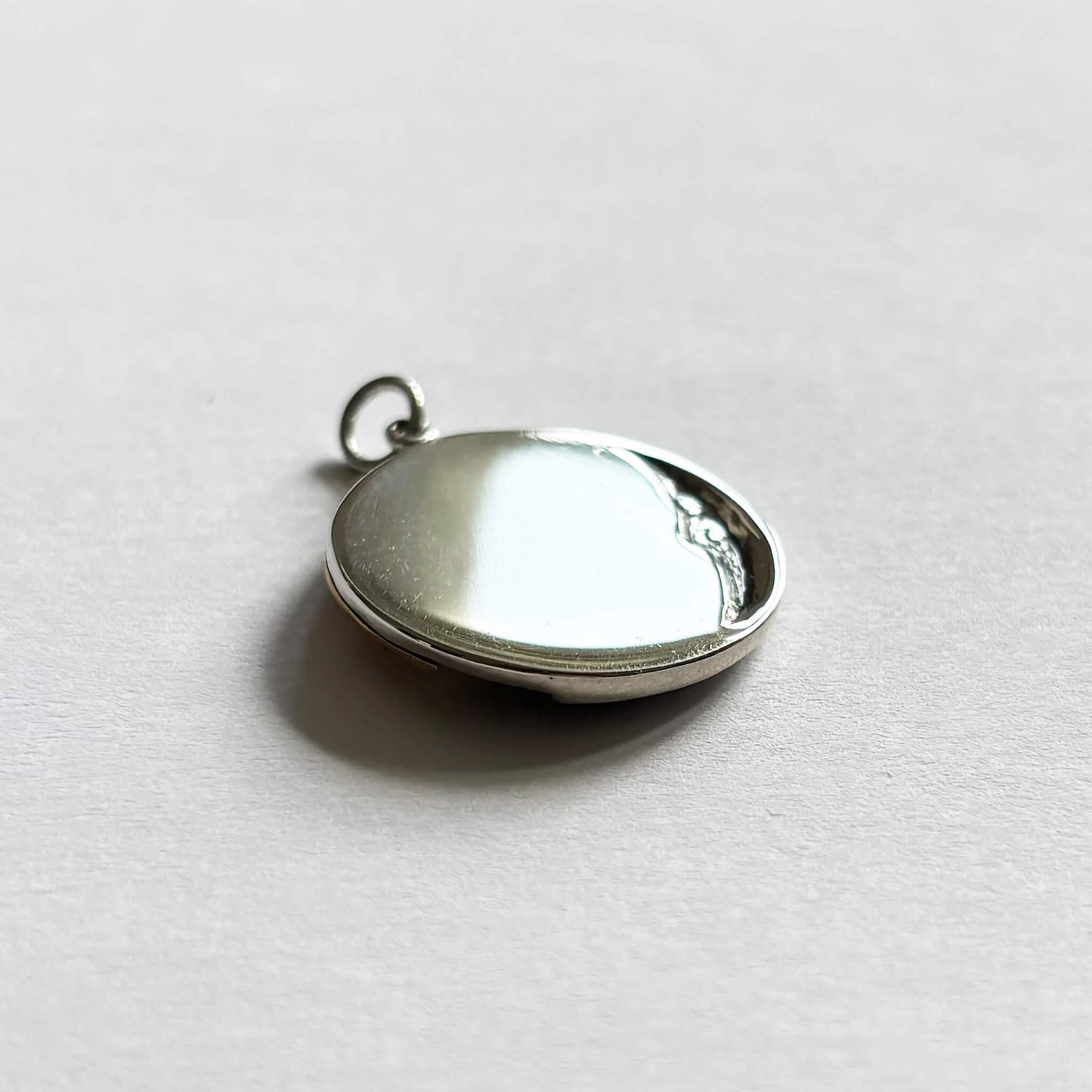 Sterling silver and bronze sun and moon charm back