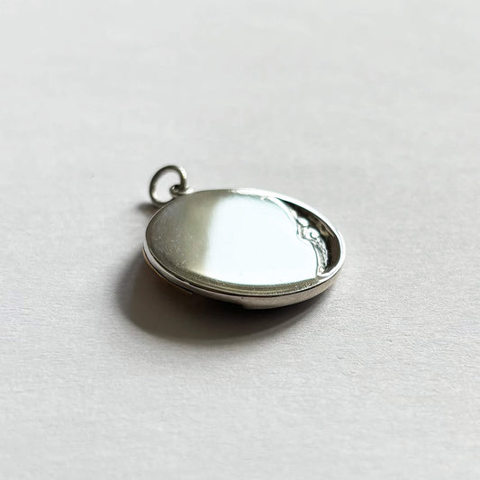 Sterling silver and bronze sun and moon charm back