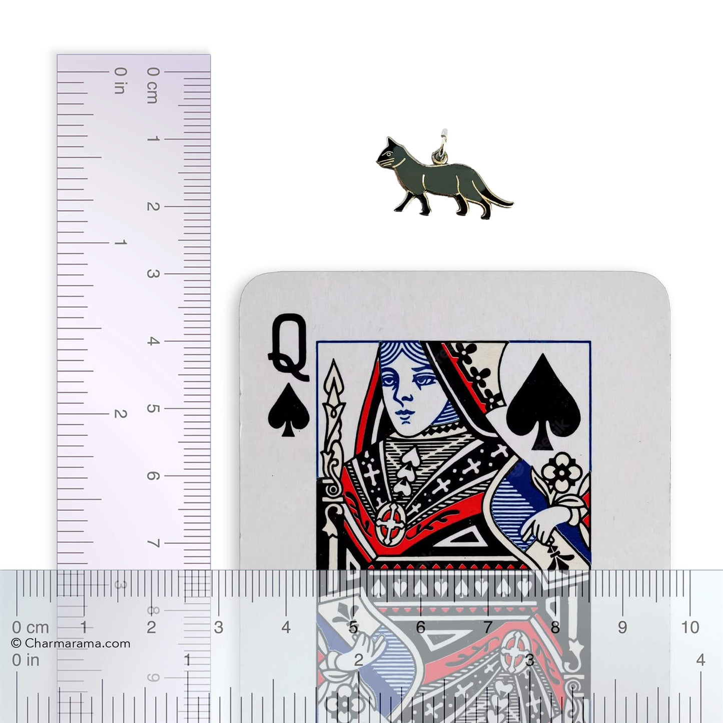 vintage cat charm with ruler and playing card for scale