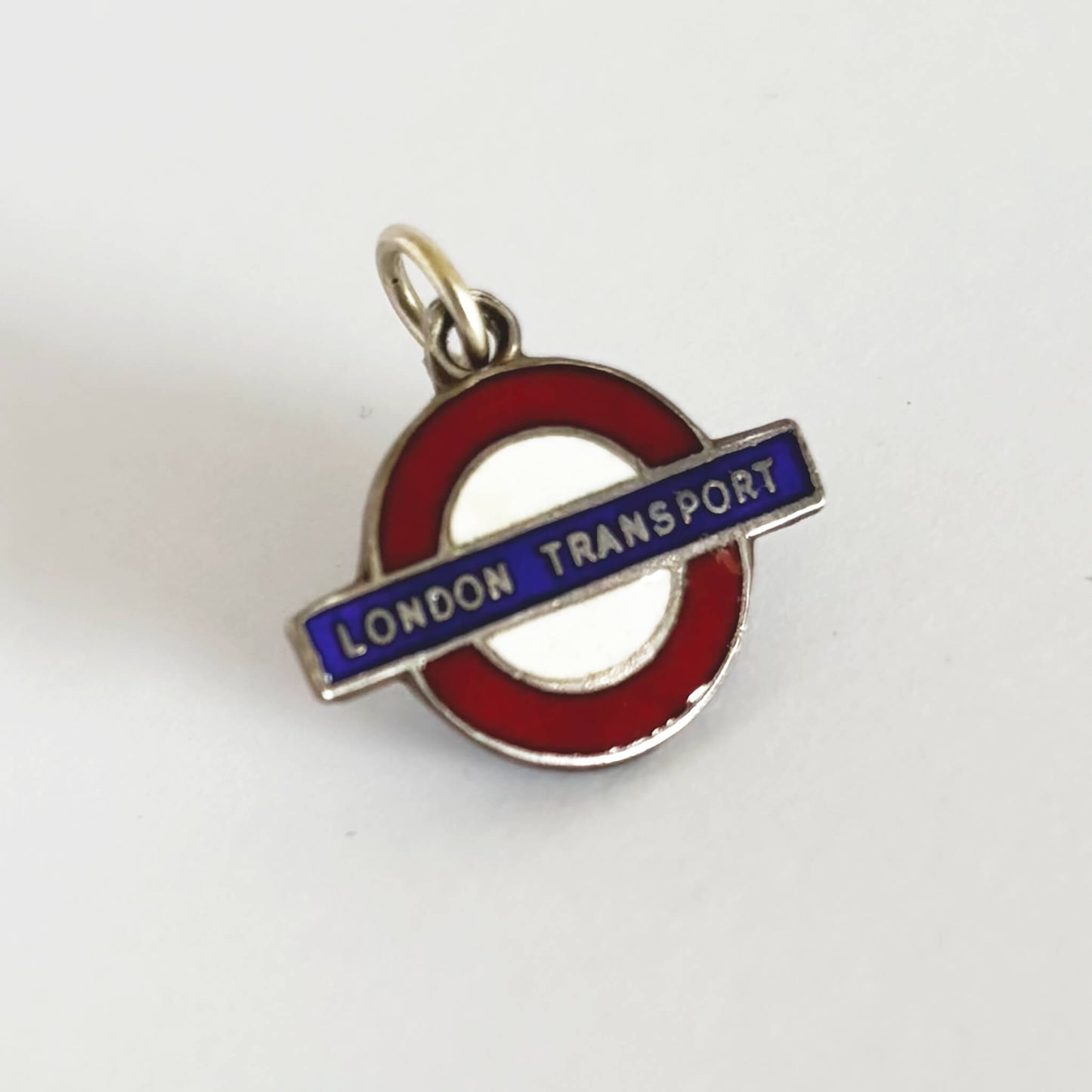 London Transport logo charm on a white background