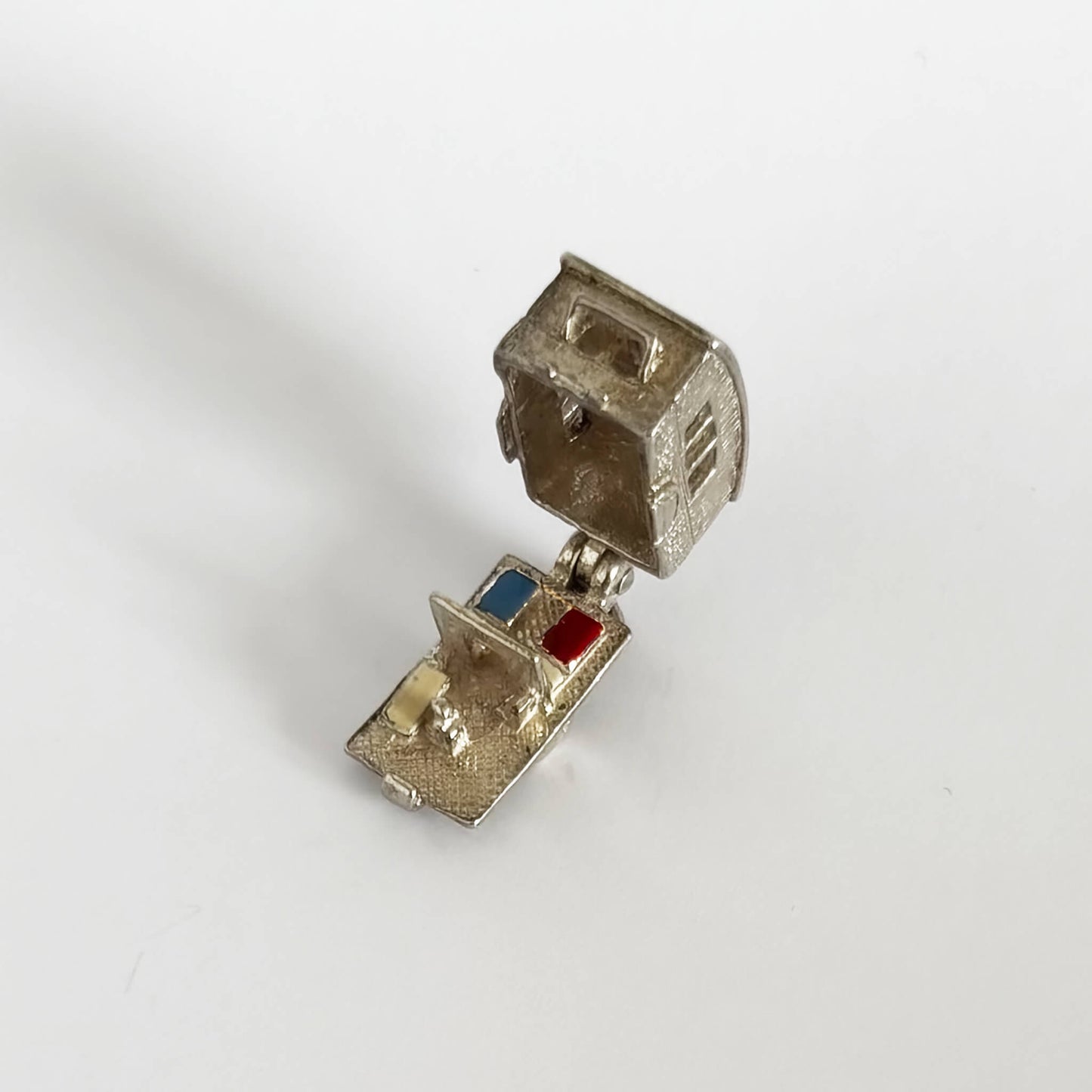 Vintage silver caravan charm opens to enamel furniture