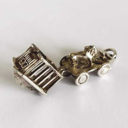 silver circus wagon charm open to reveal lion inside on a white background