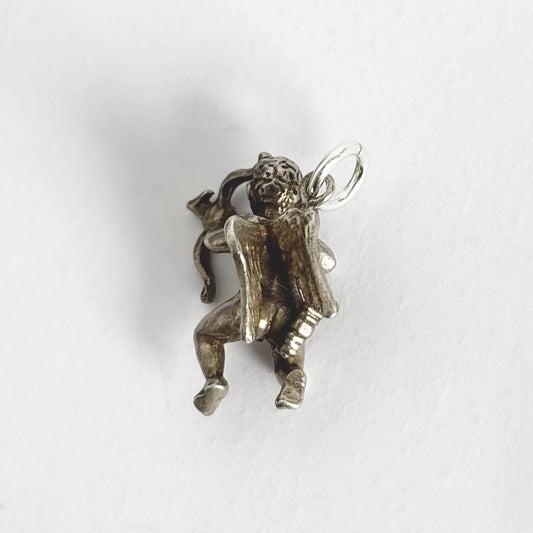 Silver cherub charm on a white background