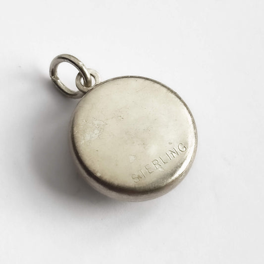 Reverse of pendant with 'STERLING' engraving on a white background