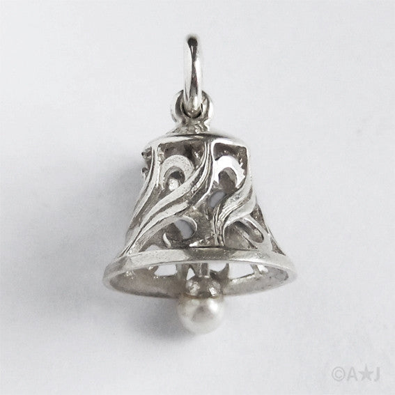 bell charm on light grey background