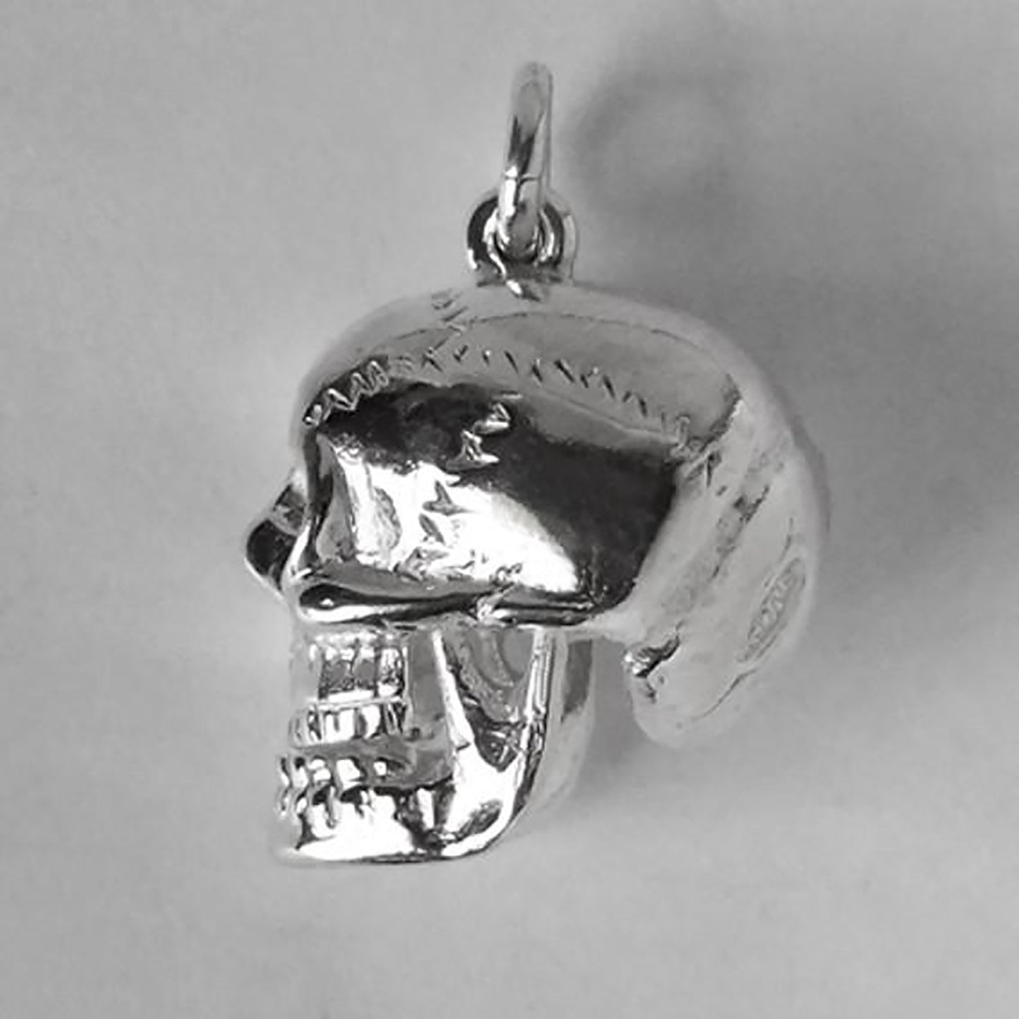skull charm with red crystal eyes
