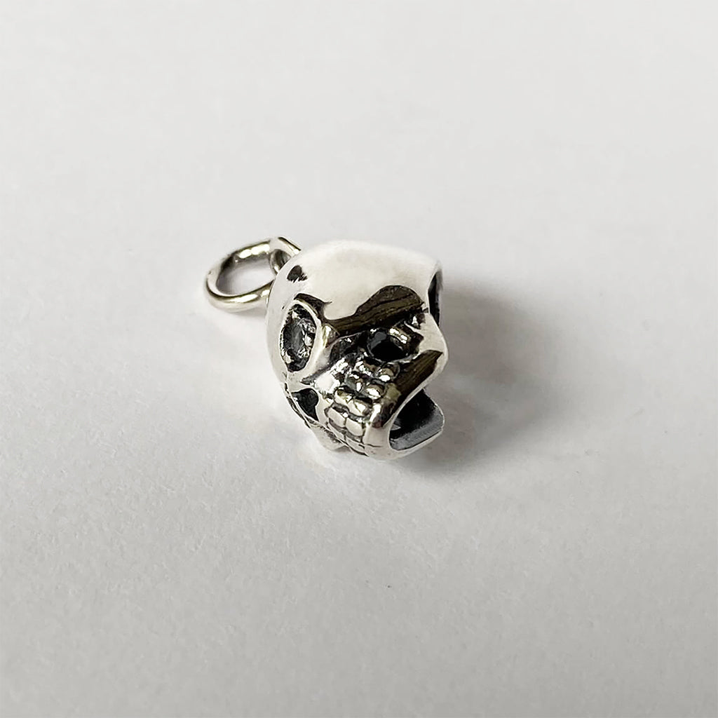 Sterling silver skull charm with crystal eyes