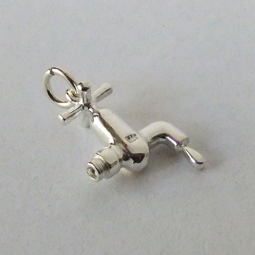 tap with water drip charm