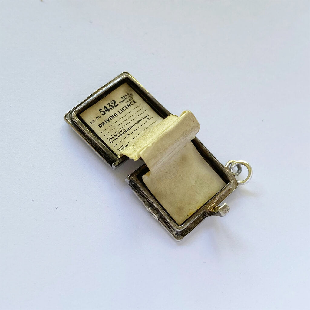 Vintage sterling silver opening driving licence charm opens to papers inside pendant
