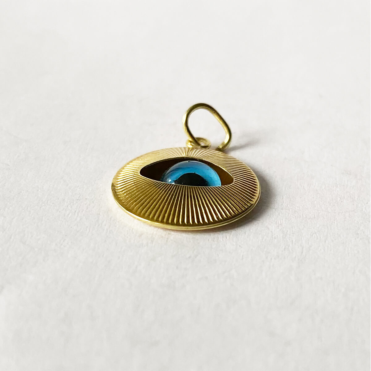 9k yellow gold nazar evil eye with moving blue glass iris