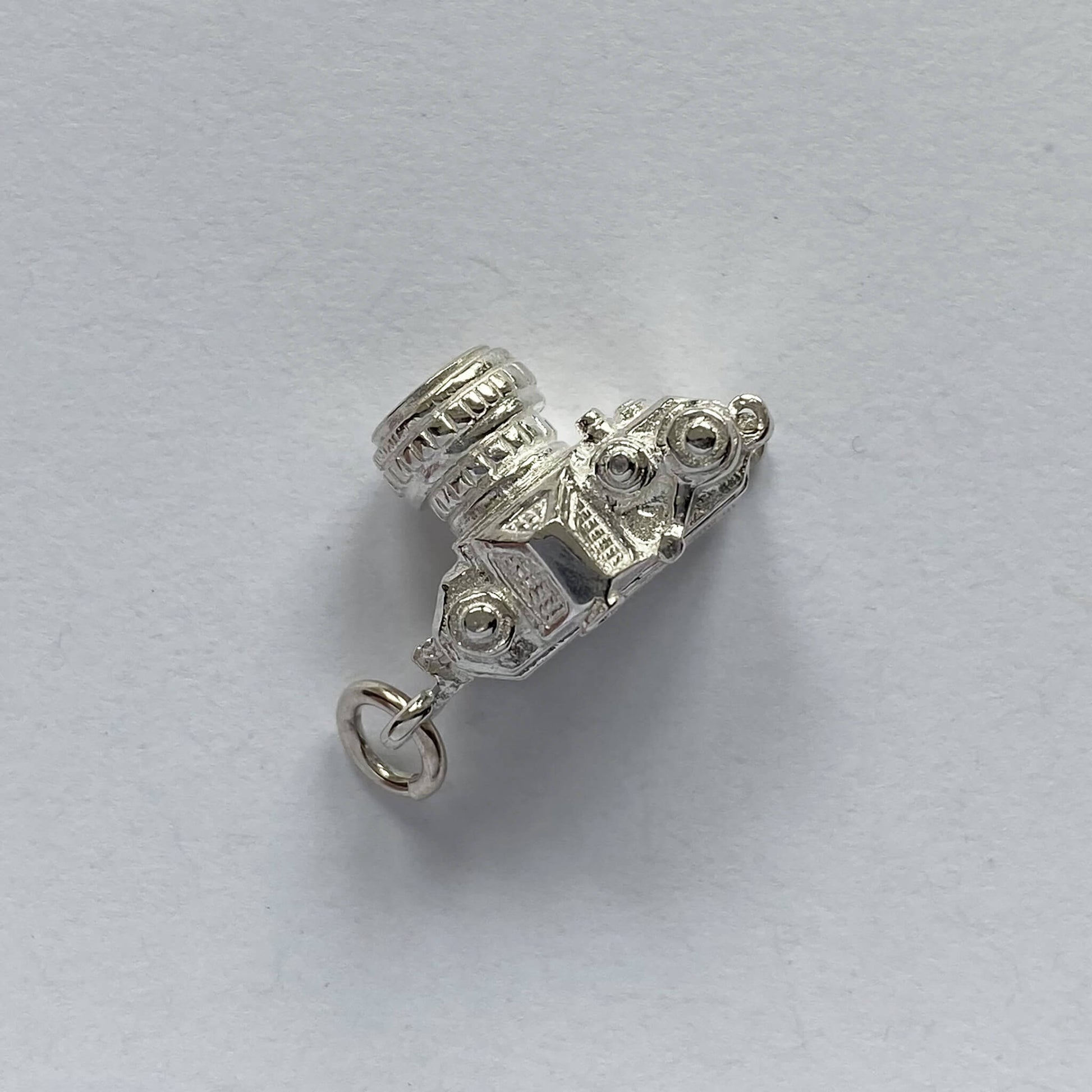 sterling silver camera charm which opens to a wedge of cheese