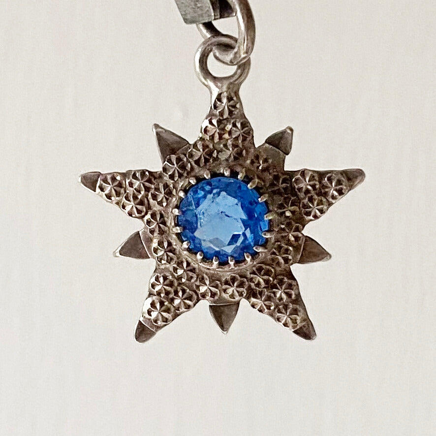 English silver antique star pendant with blue centre stone made in 1904 by Charles Horner