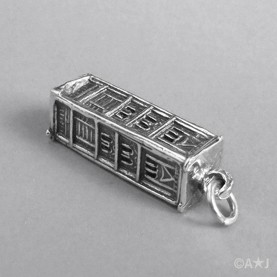Sterling Silver Giotto’s Campanile Charm lying on grey background