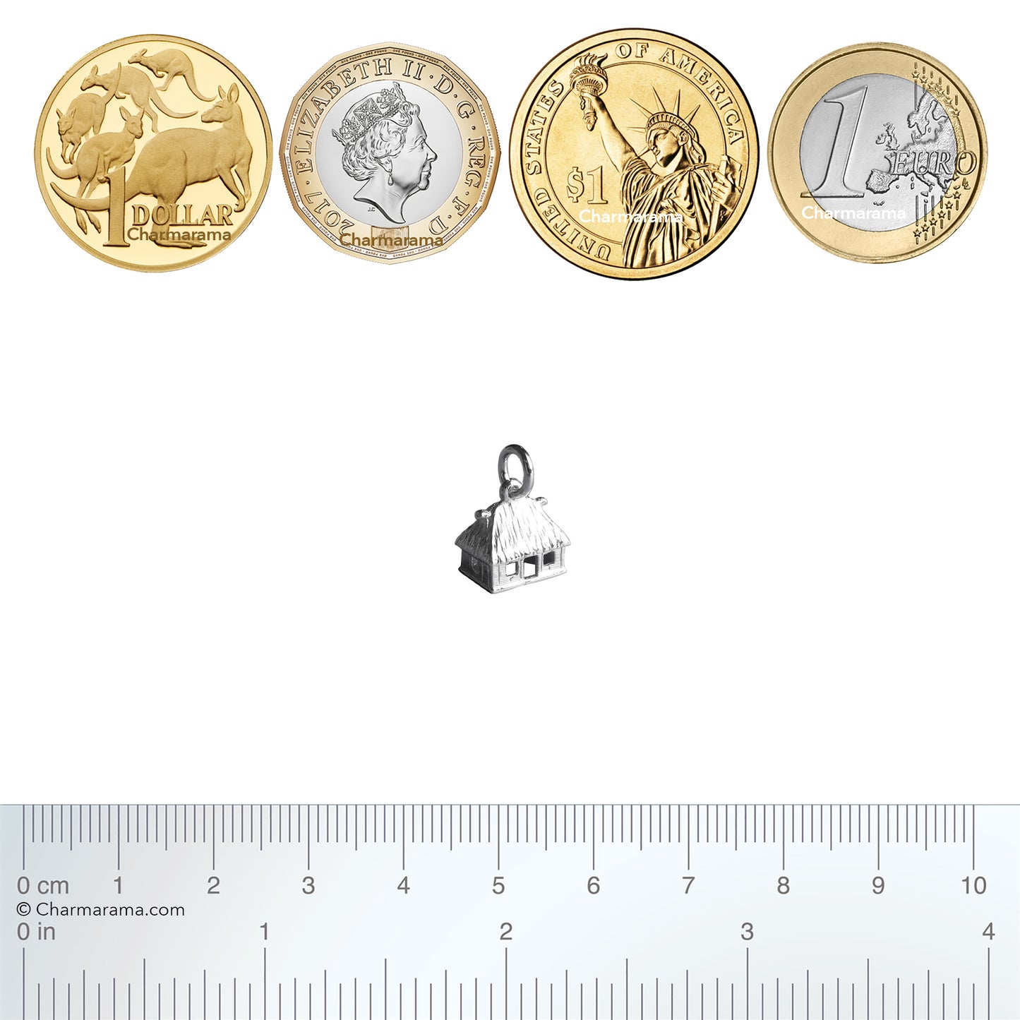Sterling silver Fijian bure charm with coins and ruler for scale on a white background