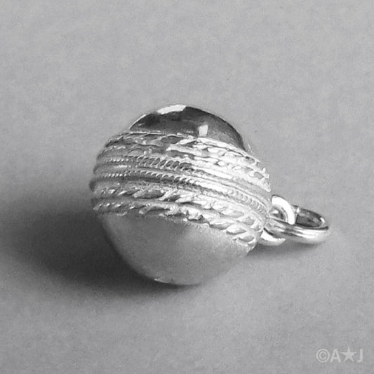 Sterling silver cricket ball charm on a white background