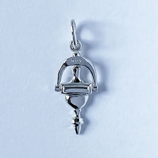 Sterling silver door knocker charm on a grey background