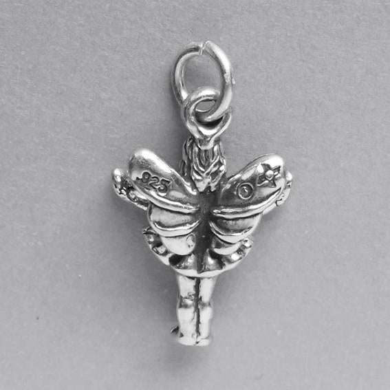 Back view of sterling silver fairy charm on a grey background