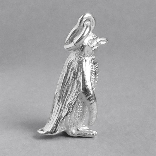 Sterling silver fairy penguin charm on a grey background