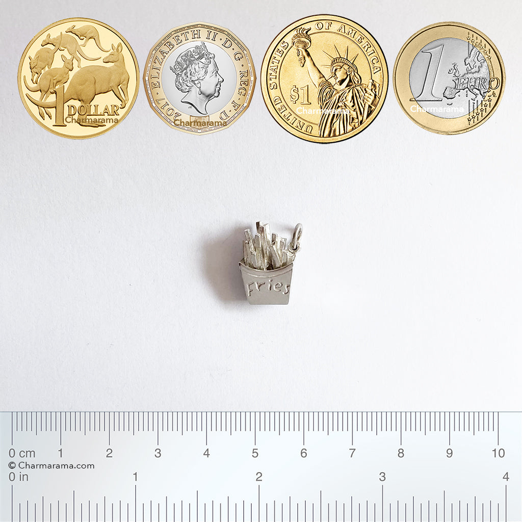 Sterling silver French fries charm with coins and ruler for scale on a white background