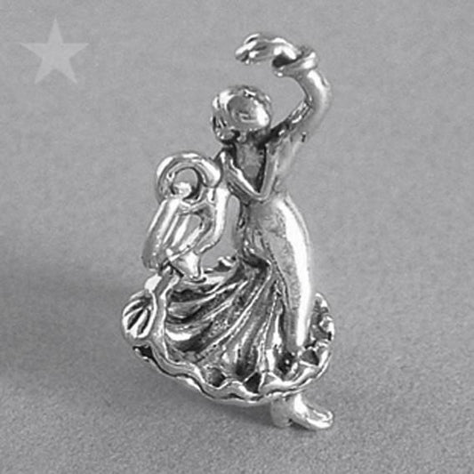 Sterling silver flamenco dancer charm on a grey background