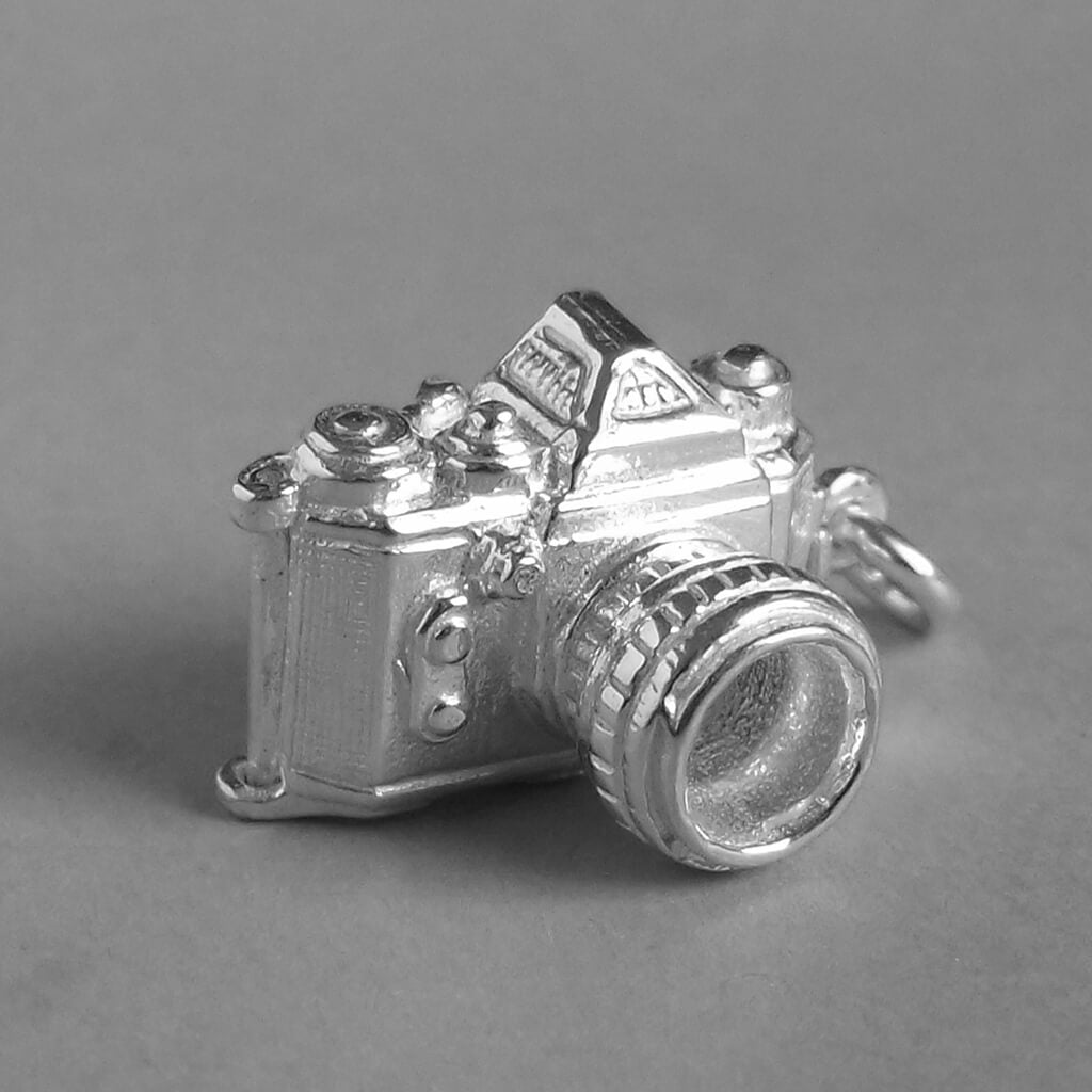 camera pendant in sterling silver opens to cheese wedge