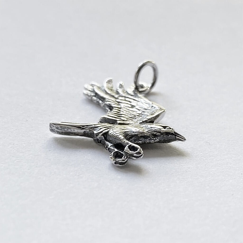 crow in flight charm