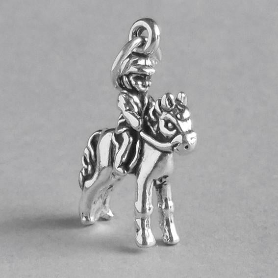child on pony charm