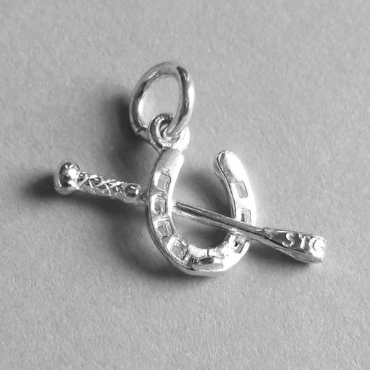 horseshoe and crop charm
