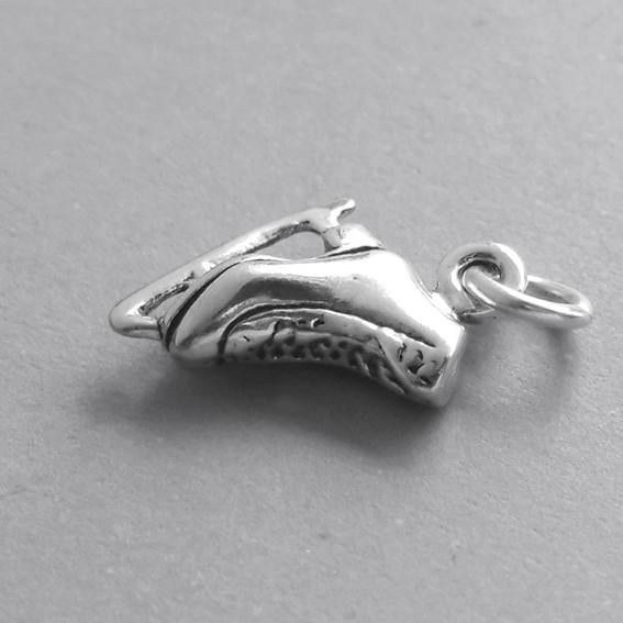 Ice skate charm tiny sterling silver on grey background