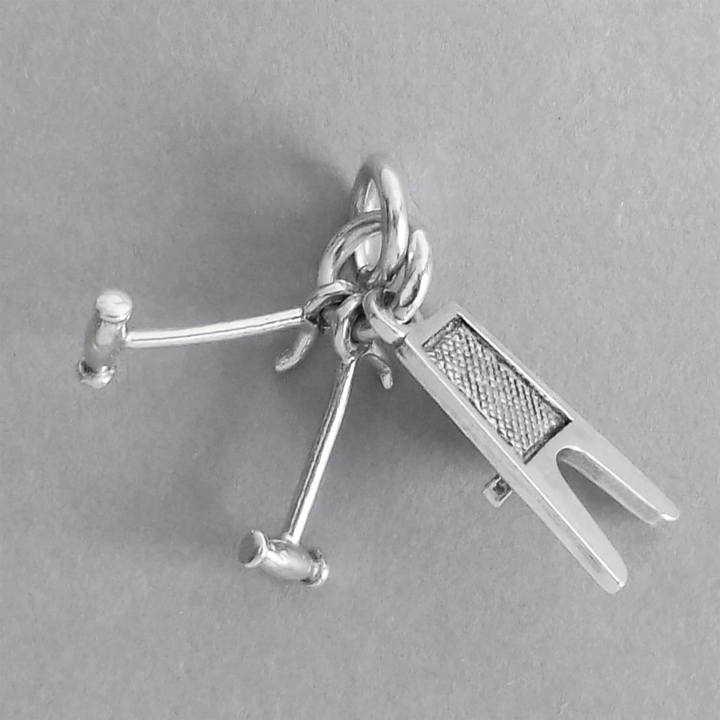 Equestrian Boot Jack and Pulls Charm Sterling Silver on a grey background